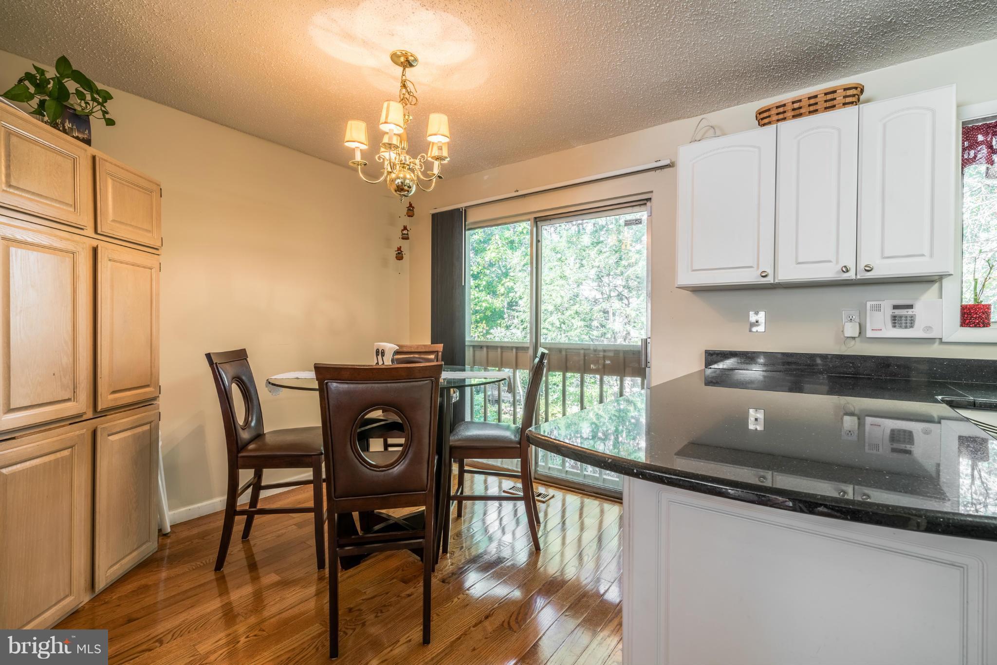 2402 Southgate Square Reston, VA 20191 - Photo 6 of 21 a view of a dining room with furniture window and outside view