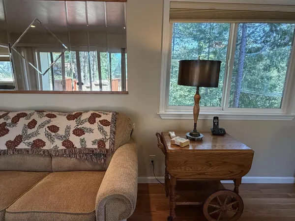 a living room with furniture and a window