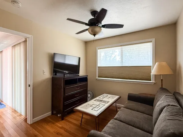 a living room with furniture and a window