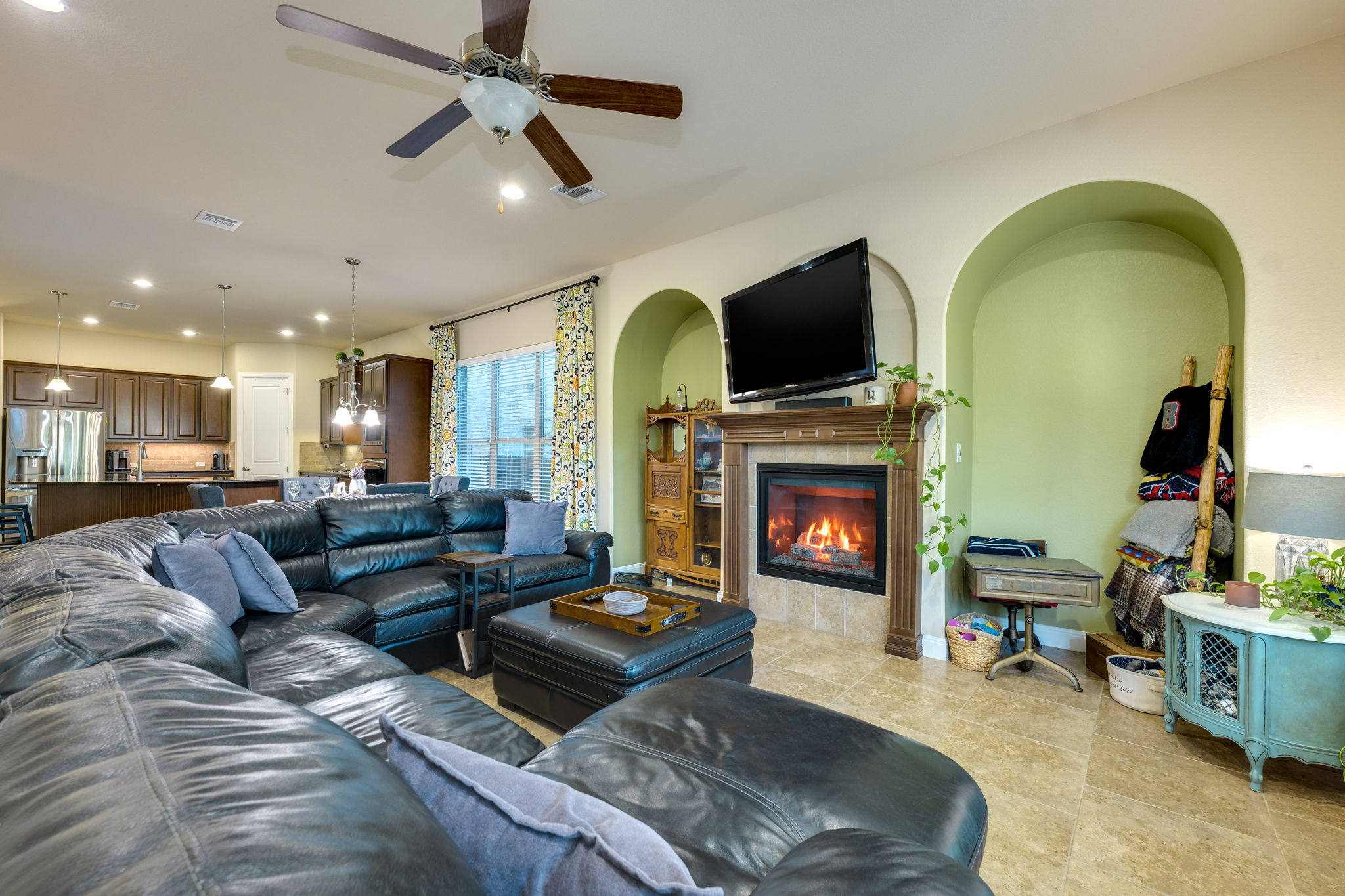 2208 Allison Way Cedar Park, TX 78613 - Photo 14 of 40 a living room with furniture a fireplace and a flat screen tv