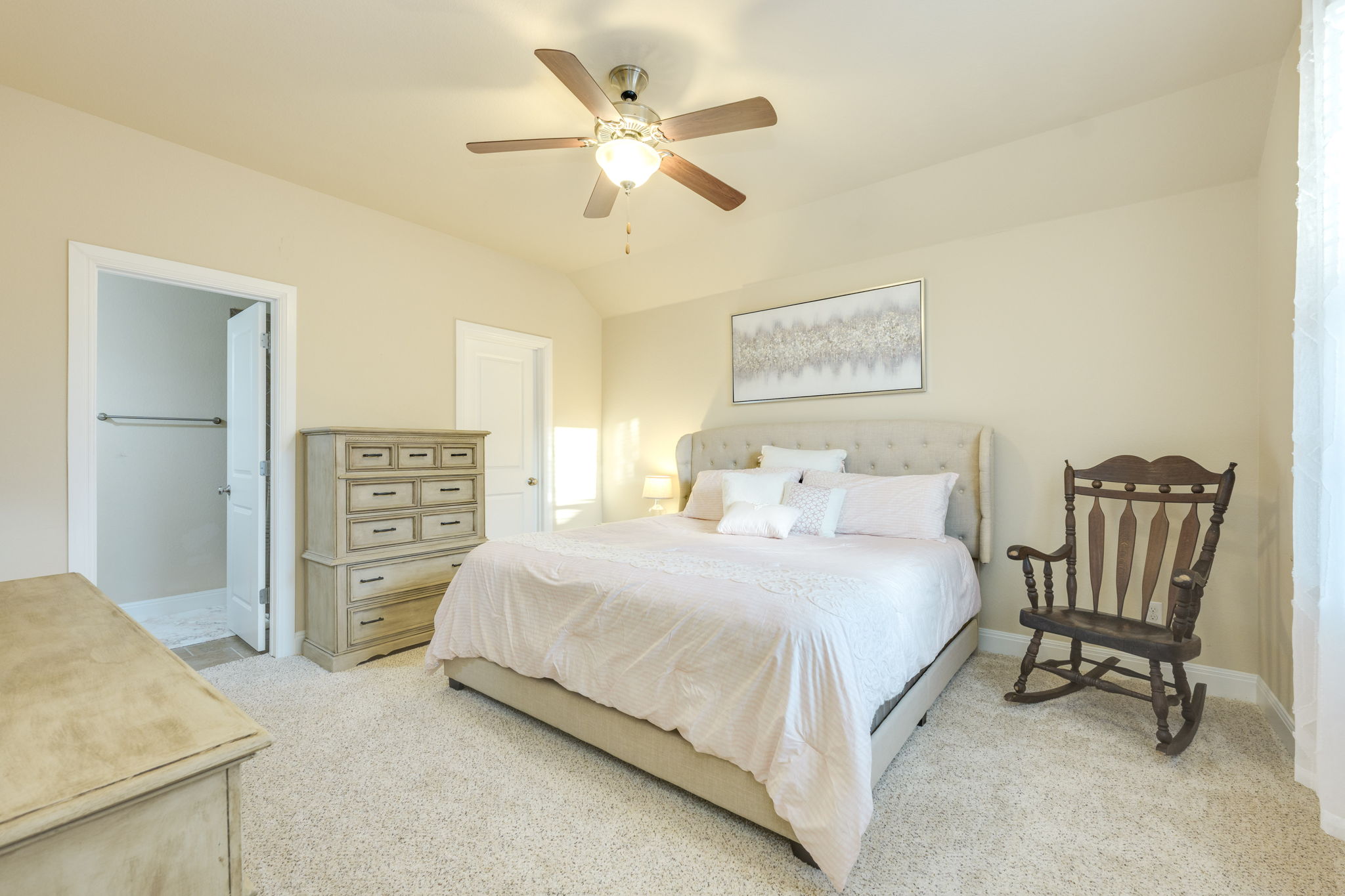 2208 Allison Way Cedar Park, TX 78613 - Photo 26 of 40 a bedroom with a bed a chair and a chandelier
