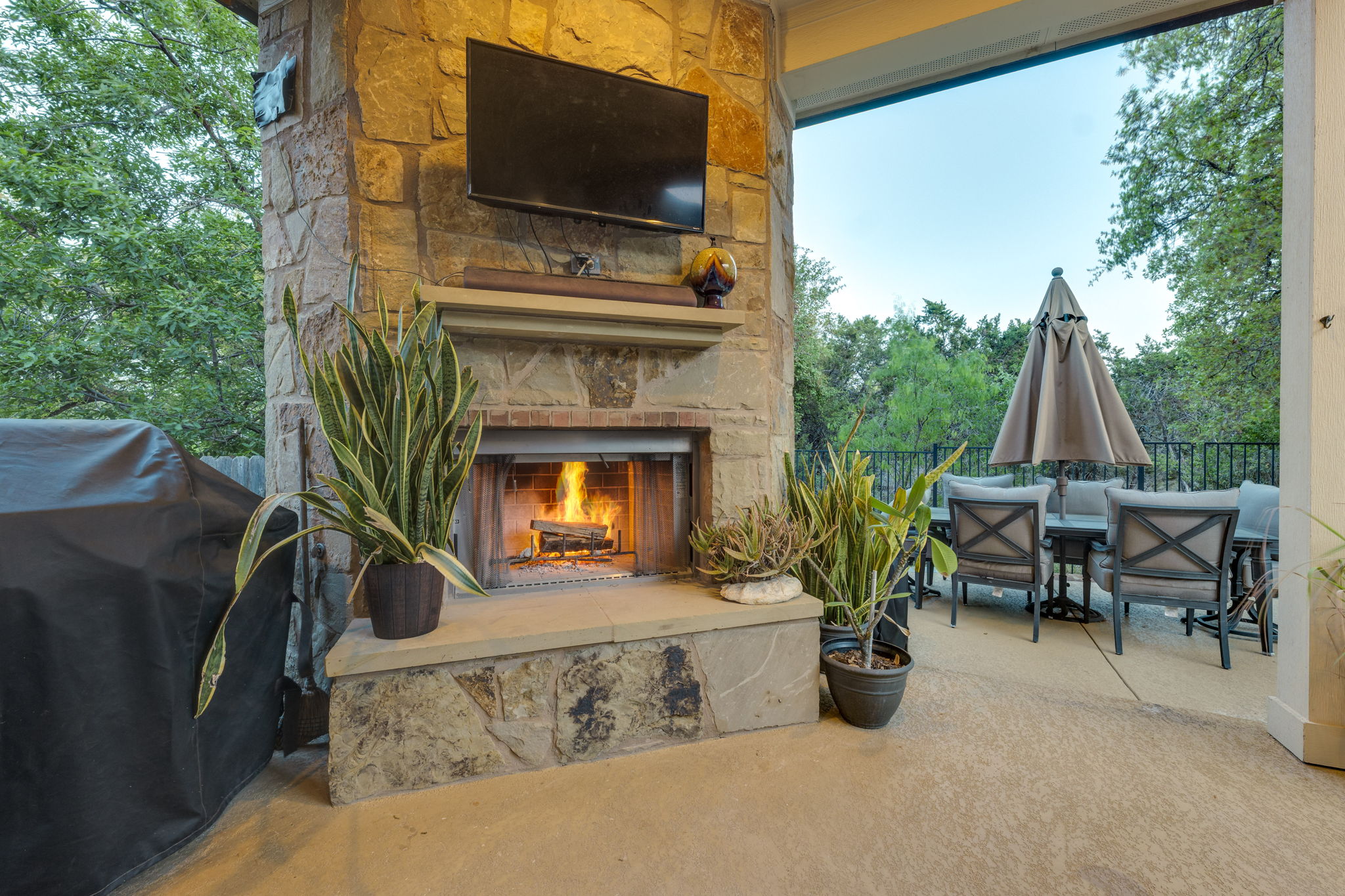 2208 Allison Way Cedar Park, TX 78613 - Photo 27 of 40 a living room with furniture a flat screen tv and a fireplace