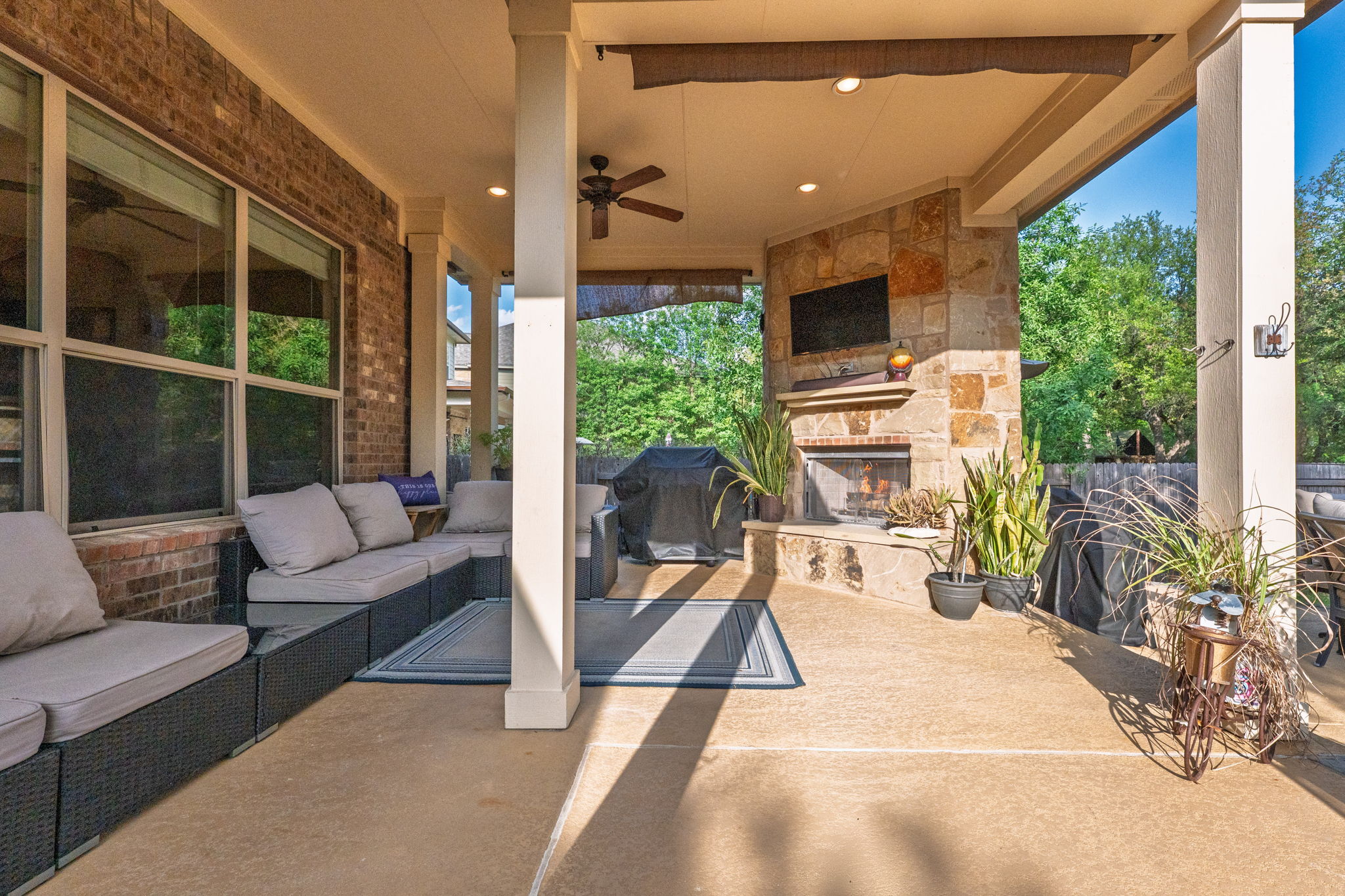 2208 Allison Way Cedar Park, TX 78613 - Photo 28 of 40 a living room with patio furniture and a fireplace