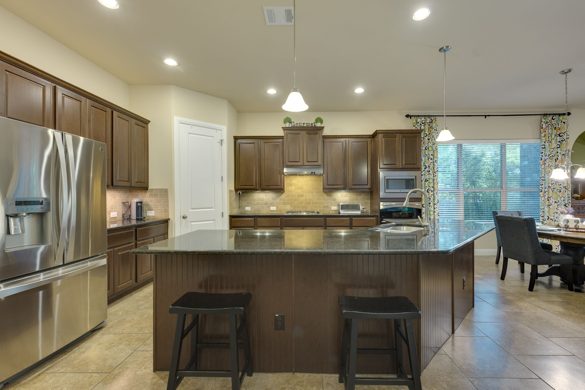 2208 Allison Way Cedar Park, TX 78613 - Photo 6 of 40 a kitchen with stainless steel appliances granite countertop counter space a sink refrigerator and cabinets