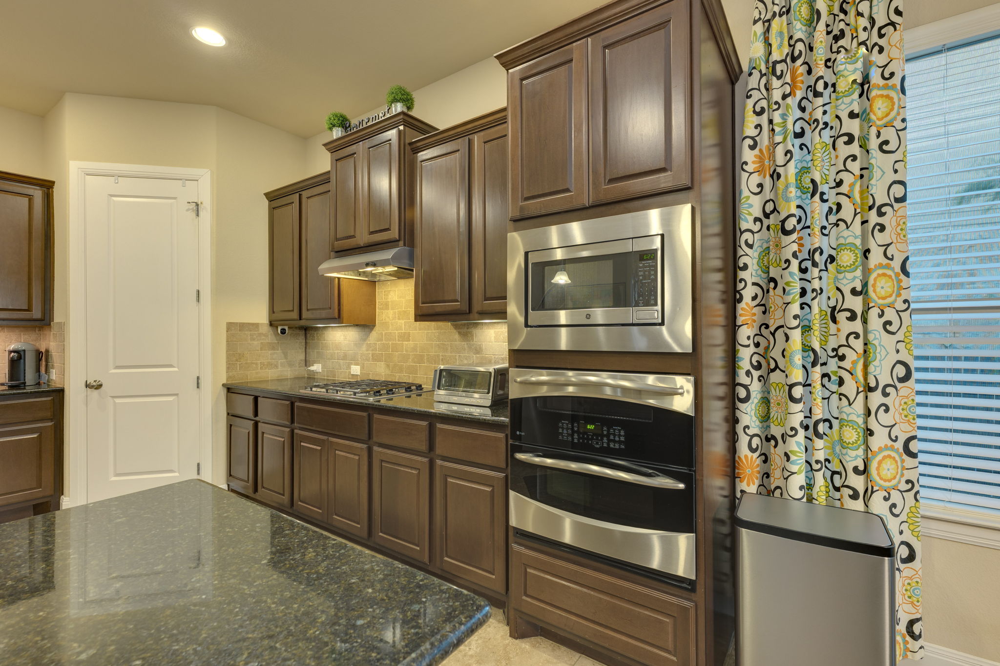 2208 Allison Way Cedar Park, TX 78613 - Photo 8 of 40 a kitchen with granite countertop stainless steel appliances and wooden cabinets