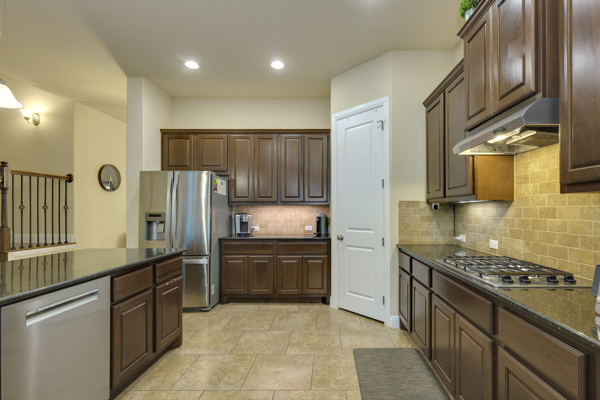 2208 Allison Way Cedar Park, TX 78613 - Photo 9 of 40 a kitchen with stainless steel appliances granite countertop a stove a sink and a refrigerator