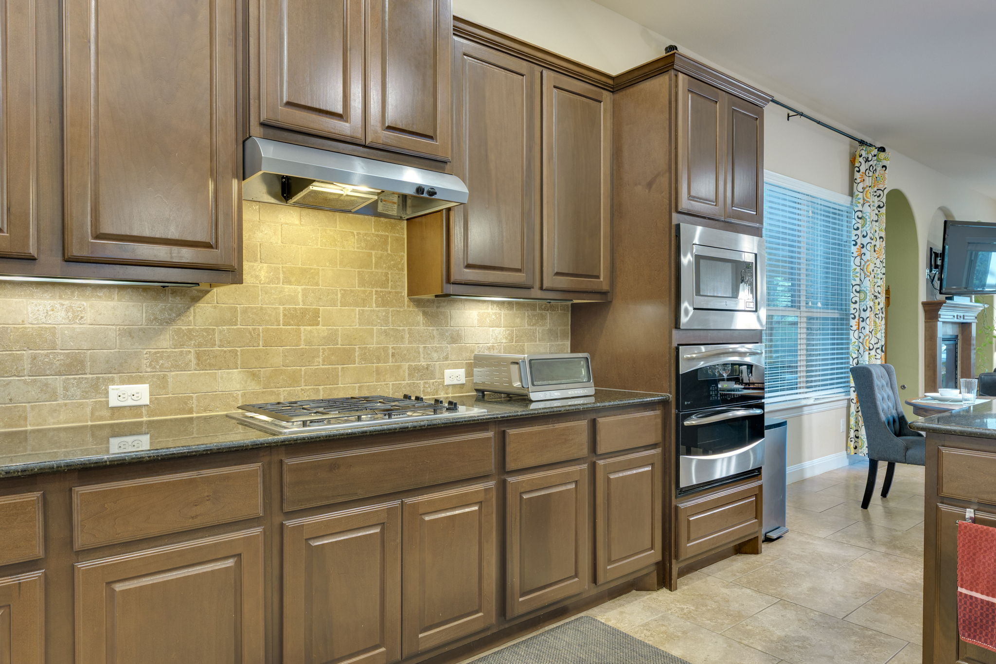 2208 Allison Way Cedar Park, TX 78613 - Photo 10 of 40 a kitchen with stainless steel appliances granite countertop a sink stove and cabinets