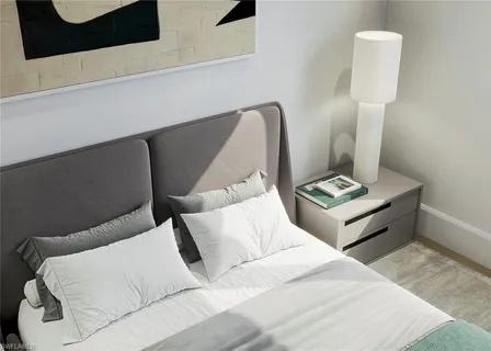 a bedroom with a bed lamp closet and window