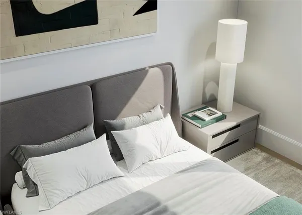 a bedroom with a bed lamp closet and window