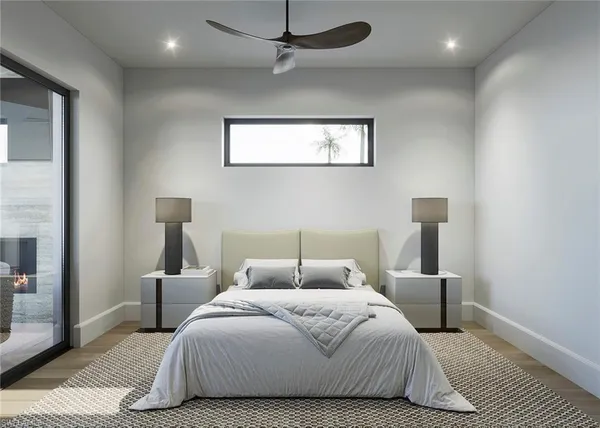 a bedroom with a bed and a lamp