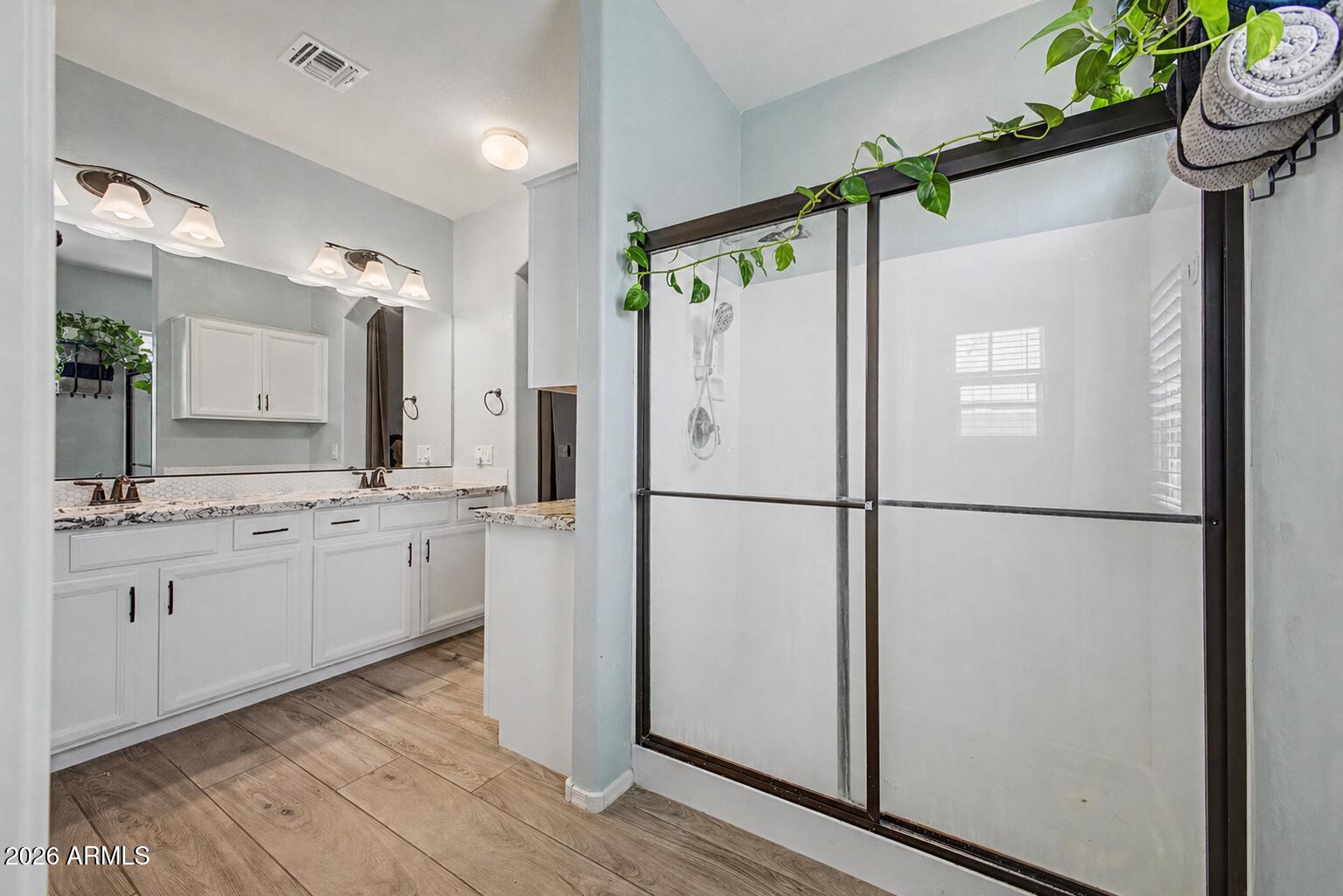 16719 West Rowel Road Surprise, AZ 85387 - Photo 15 of 28 a kitchen with stainless steel appliances a refrigerator and a sink