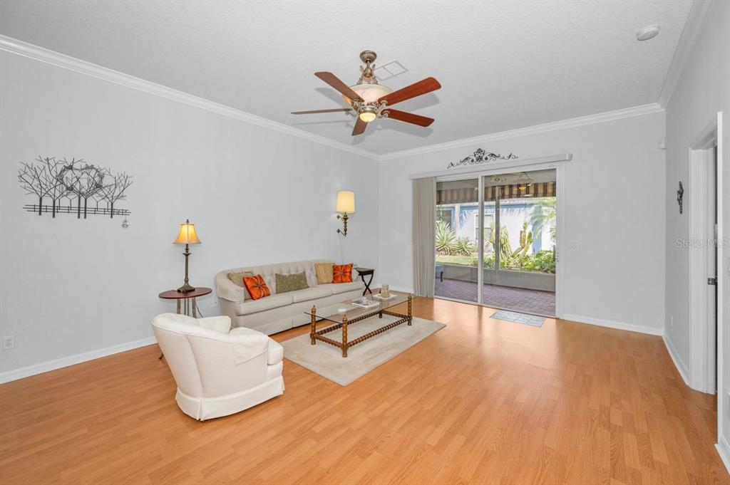 12154 Putter Green Court New Port Richey, FL 34654 - Photo 16 of 73 a living room with furniture and a window