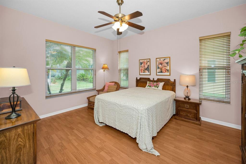 12154 Putter Green Court New Port Richey, FL 34654 - Photo 21 of 73 a bedroom with a bed and a large window