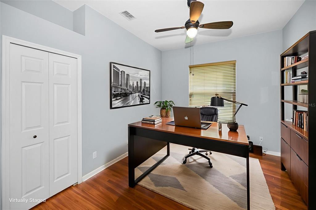 12154 Putter Green Court New Port Richey, FL 34654 - Photo 26 of 73 a view of a workspace with furniture and a bookshelf