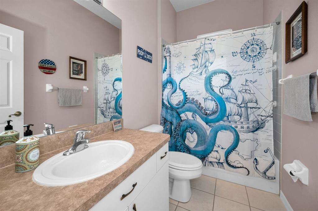 12154 Putter Green Court New Port Richey, FL 34654 - Photo 27 of 73 a bathroom with a sink toilet and shower