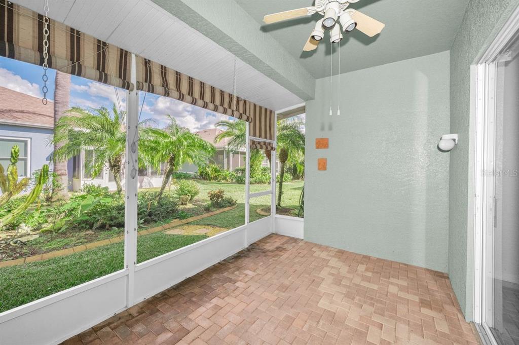 12154 Putter Green Court New Port Richey, FL 34654 - Photo 30 of 73 a view of an entryway with a flower garden