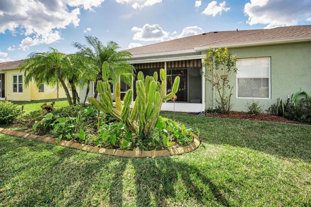 12154 Putter Green Court New Port Richey, FL 34654 - Photo 33 of 73 a front view of a house with garden