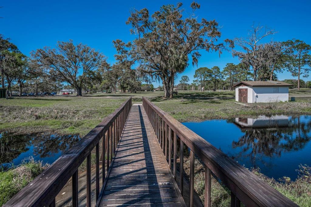 12154 Putter Green Court New Port Richey, FL 34654 - Photo 45 of 73 a view of a balcony with two chairs and a table