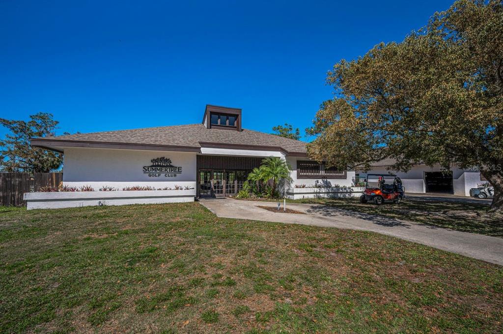 12154 Putter Green Court New Port Richey, FL 34654 - Photo 47 of 73 a front view of a house with a garden