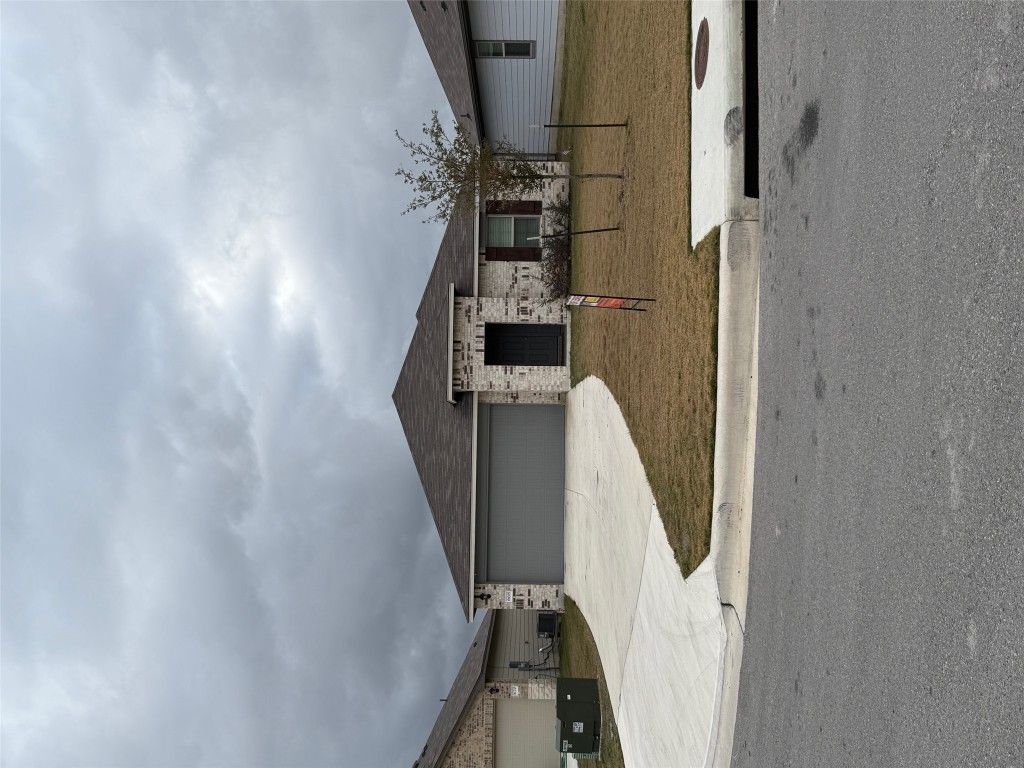 668 Wyatt Way Jarrell, TX 76537 - Photo 1 of 2 a front view of a house with a yard