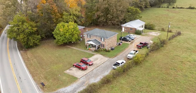 an aerial view of a house with outdoor space