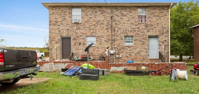 swimming pool with outdoor seating and yard