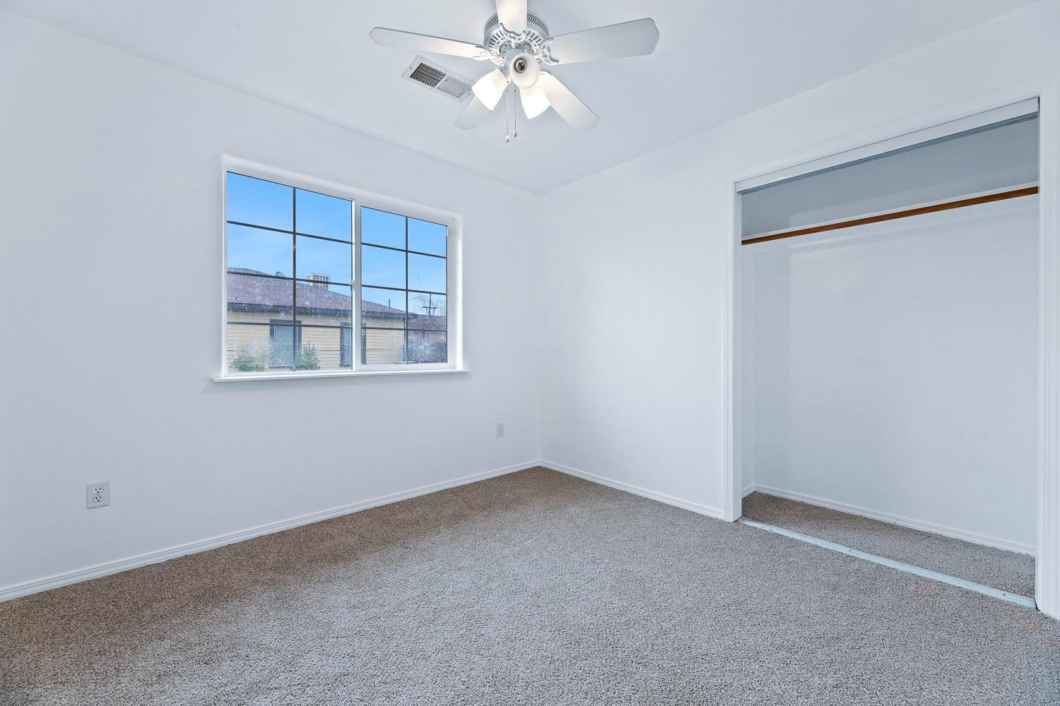 249 Jackson Street Coalinga, CA 93210 - Photo 17 of 42 a view of an empty room with a window