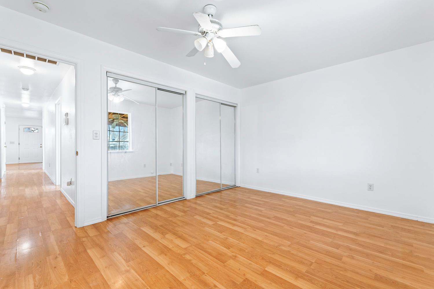 249 Jackson Street Coalinga, CA 93210 - Photo 22 of 42 a view of empty room with wooden floor