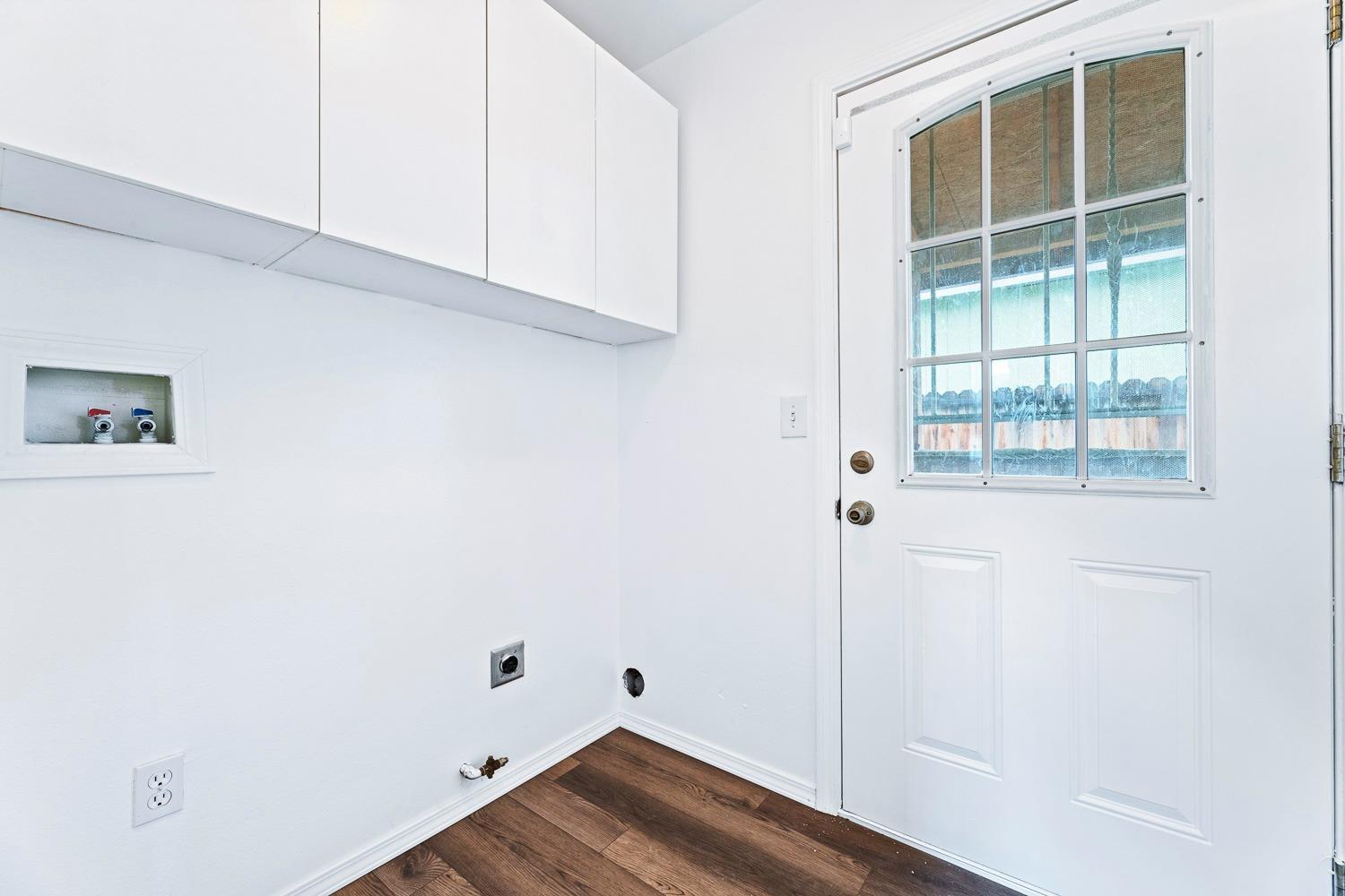 249 Jackson Street Coalinga, CA 93210 - Photo 28 of 42 a view of empty room with wooden floor