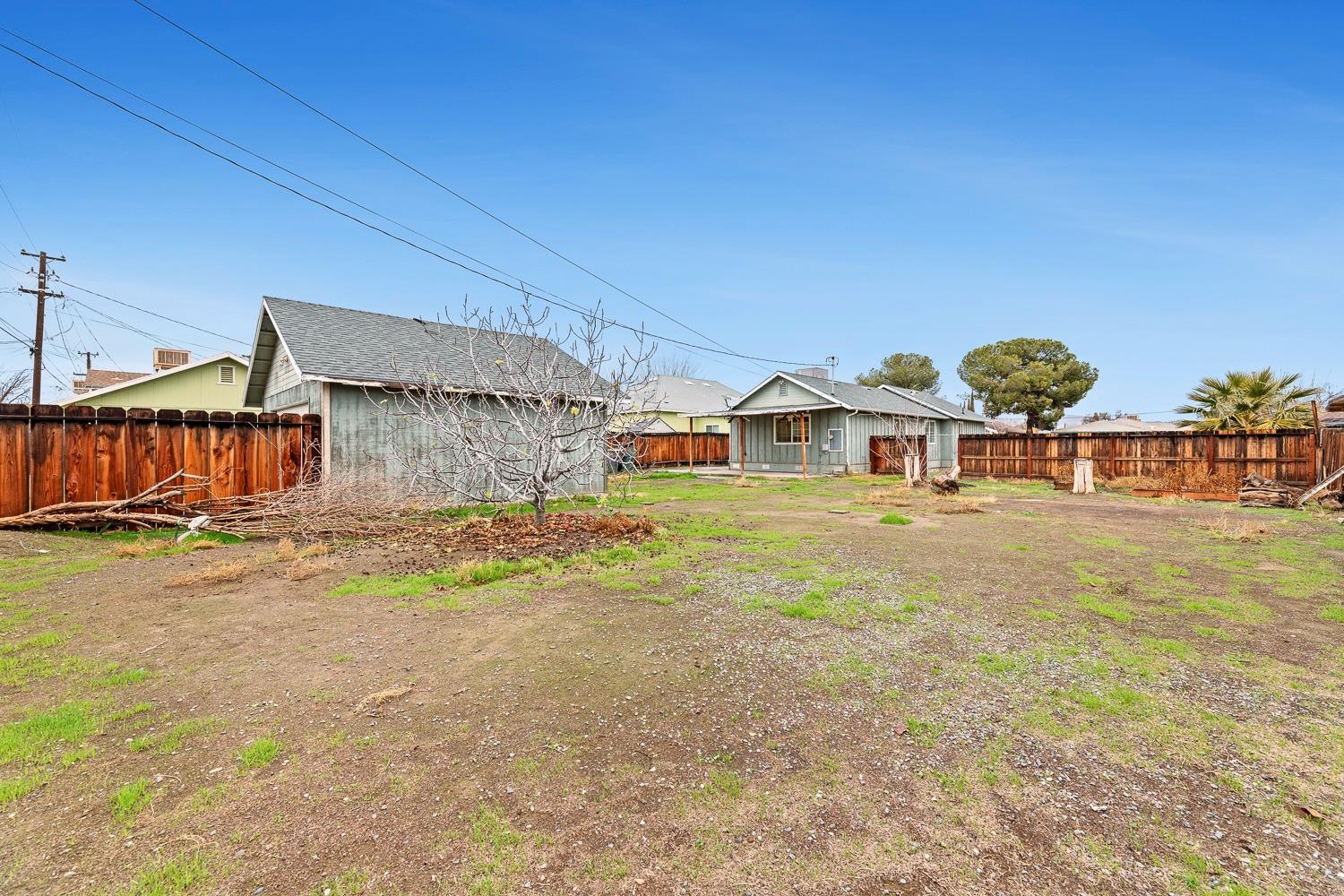 249 Jackson Street Coalinga, CA 93210 - Photo 32 of 42 front view of a house with a yard
