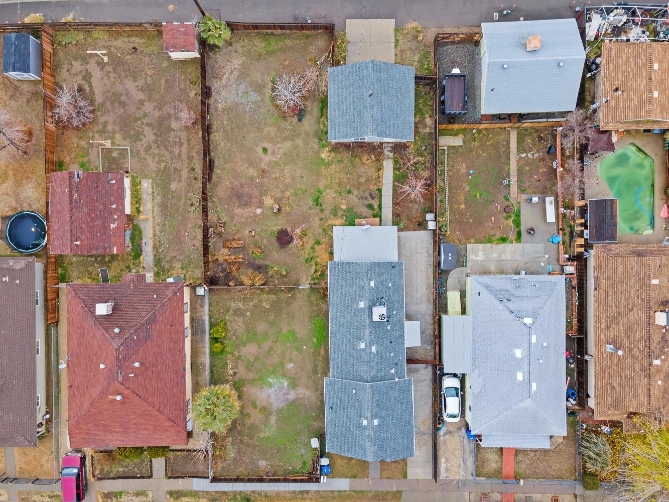 249 Jackson Street Coalinga, CA 93210 - Photo 38 of 42 an aerial view of residential houses with outdoor space and parking