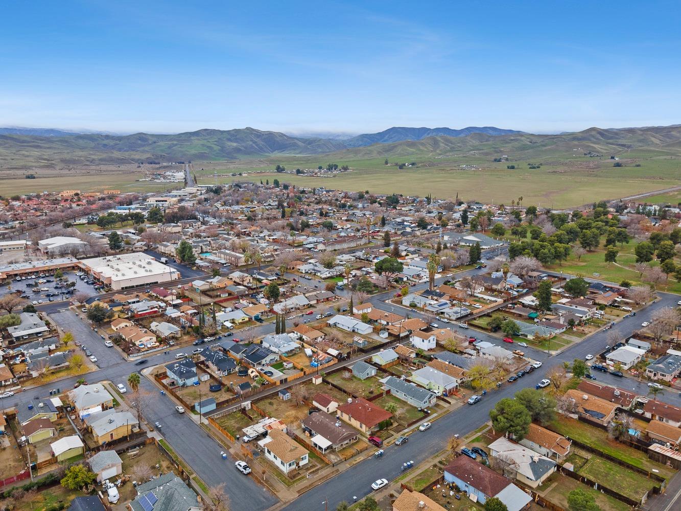 249 Jackson Street Coalinga, CA 93210 - Photo 41 of 42 an aerial view of residential houses with outdoor space and ocean view