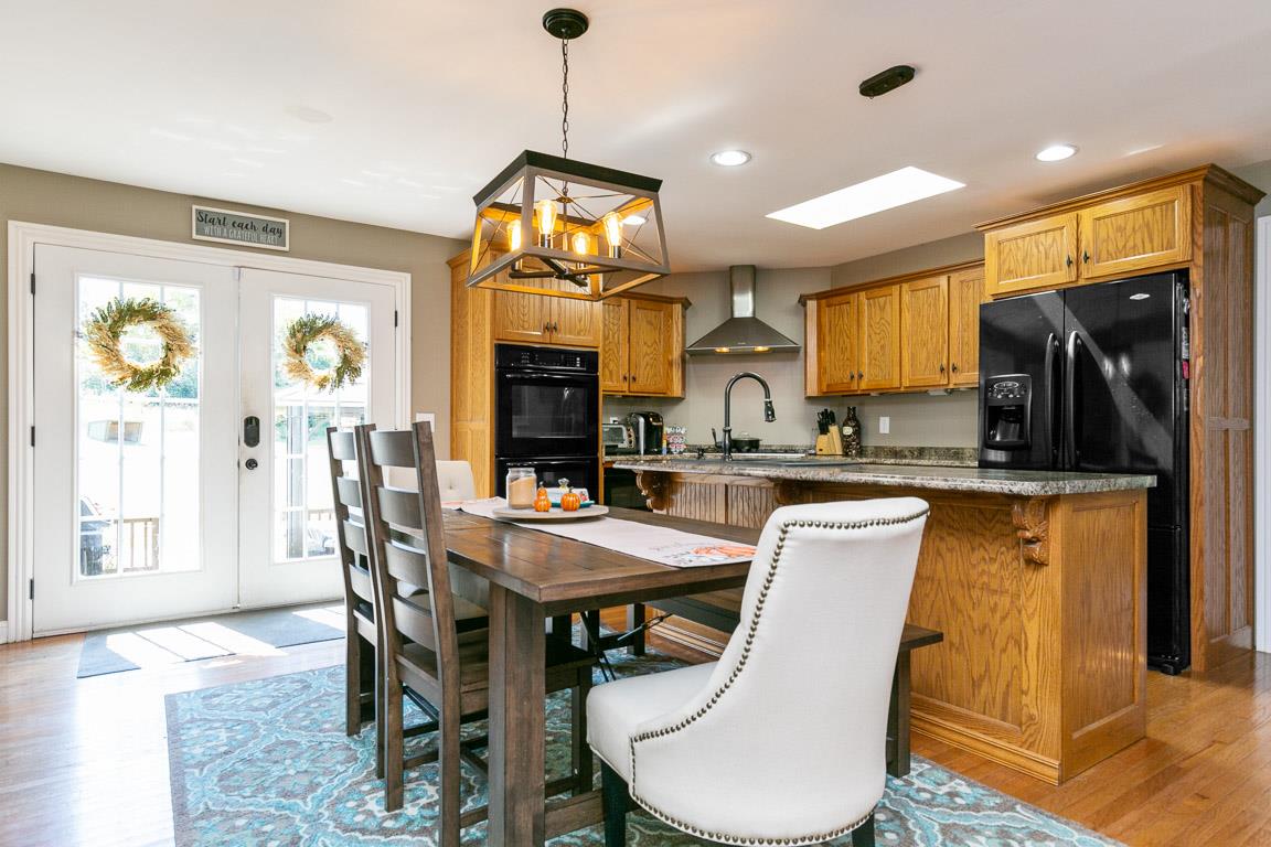 169 Dry Fork Road South Gallatin, TN 37066 - Photo 8 of 23 A farmhouse style table fits nicely in the eat-in area of the kitchen.