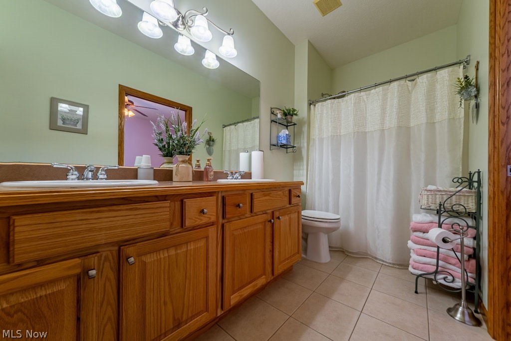 41341 Ravines Edge Way Lagrange, OH 44050 - Photo 36 of 50 The shared bathroom has a double sink vanity and a tub/shower combo with ceramic tile flooring