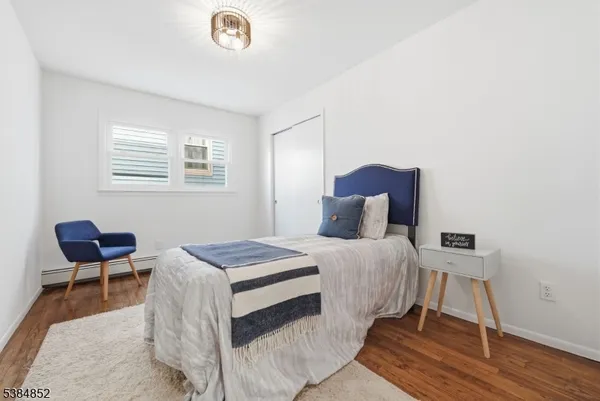 a bedroom with a bed and a chair