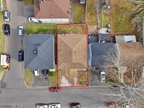 an aerial view of houses with a street