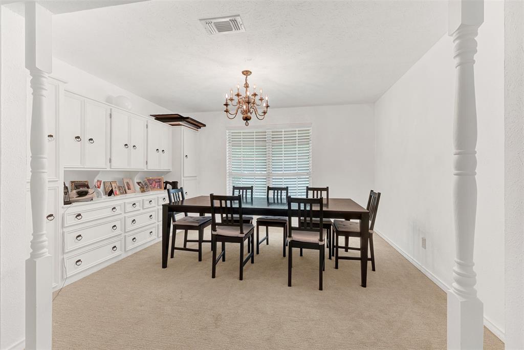 1415 South Joe Wilson Road Cedar Hill, TX 75104 - Photo 17 of 17 a view of a dining room with furniture and chandelier