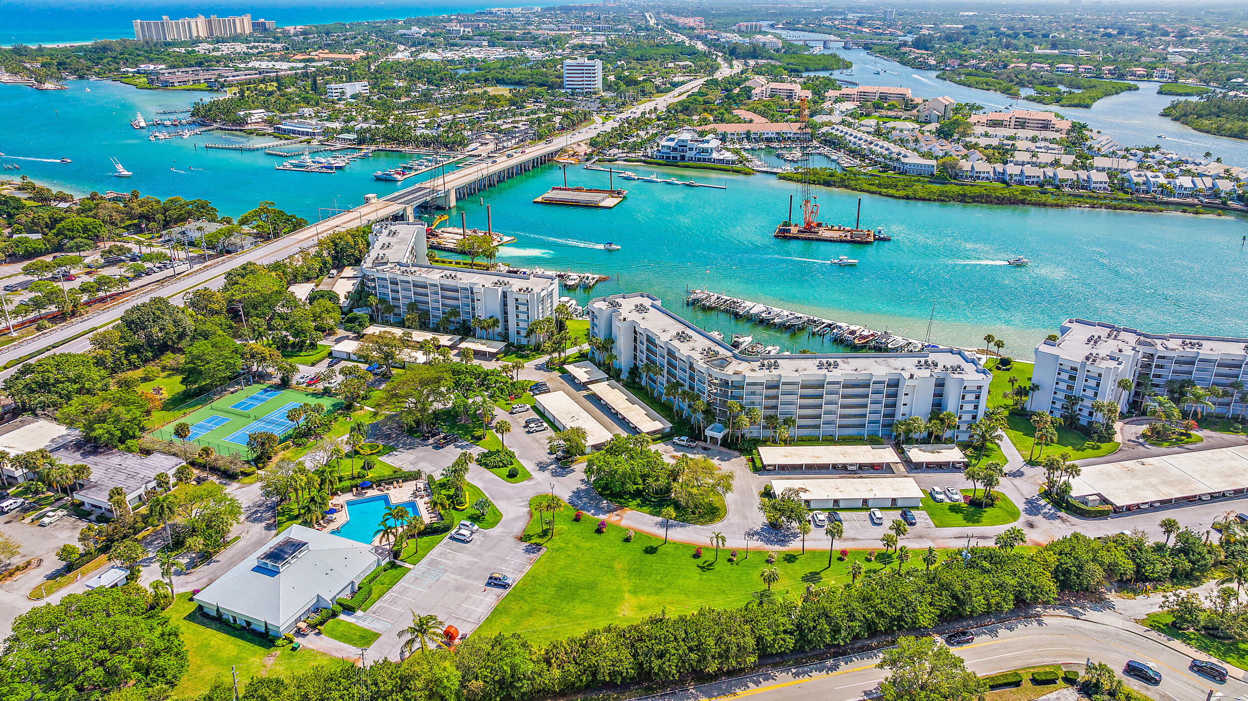 1648 Jupiter Cove Drive, Unit 514B Jupiter, FL 33469 - Photo 17 of 21 an aerial view of residential houses with outdoor space and river
