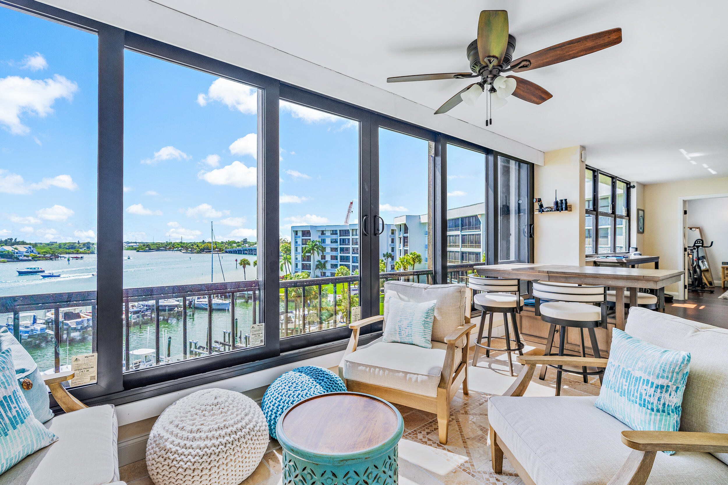 1648 Jupiter Cove Drive, Unit 514B Jupiter, FL 33469 - Photo 2 of 21 a living room with furniture and a large window