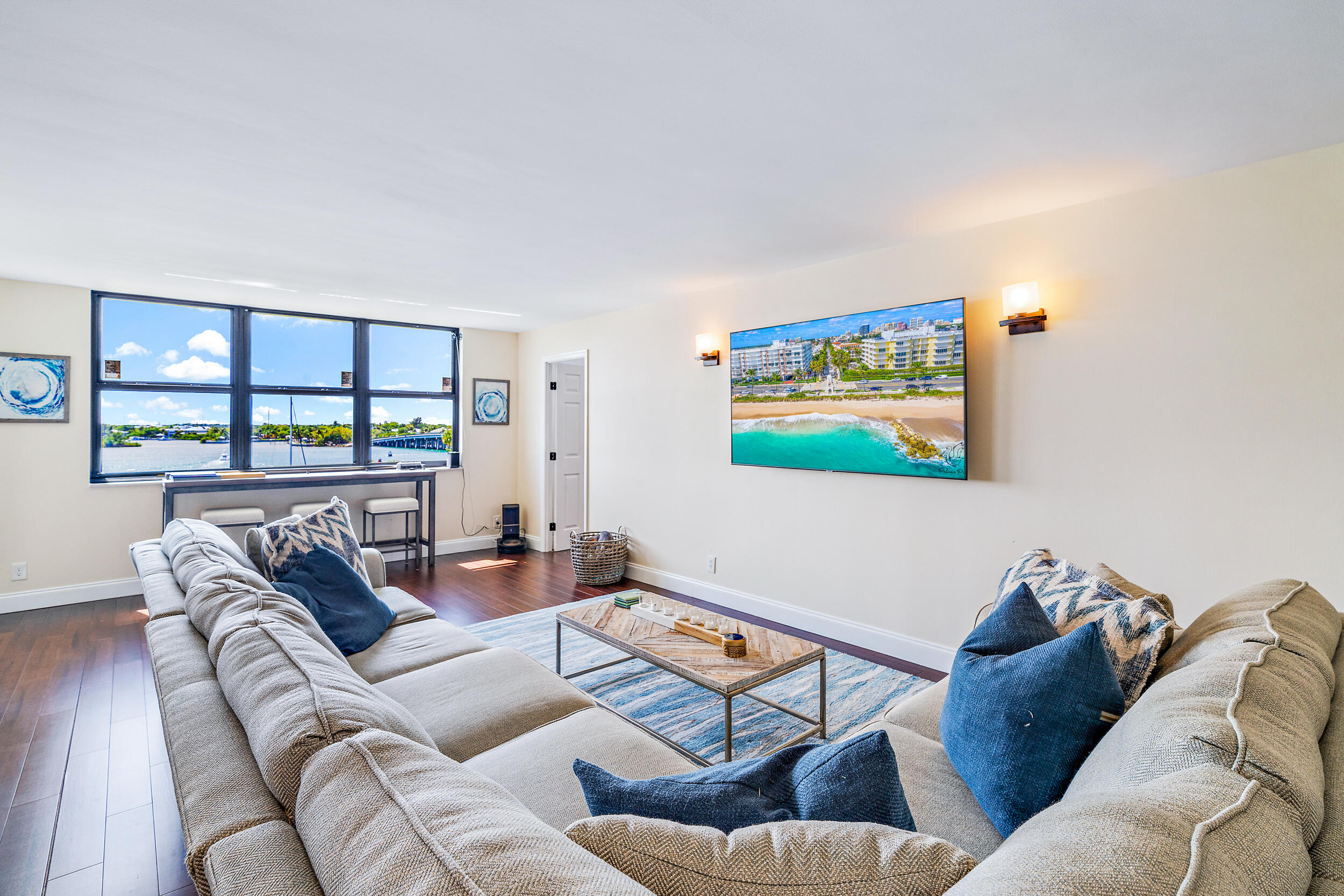 1648 Jupiter Cove Drive, Unit 514B Jupiter, FL 33469 - Photo 4 of 21 a living room with furniture and a floor to ceiling window