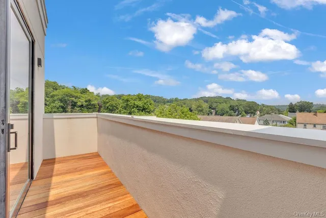 a view of kitchen with wooden floor and window