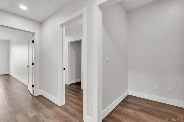 a view of a hallway with washer and dryer