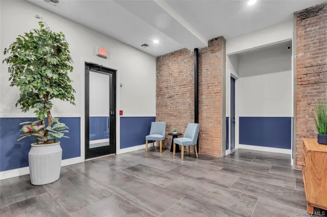 a view of livingroom with furniture and a potted plant