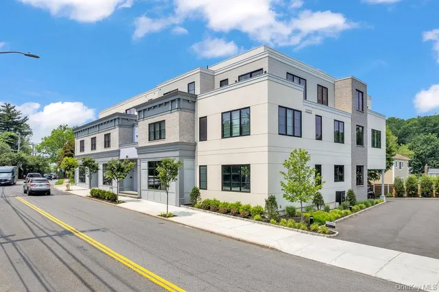a front view of a building with street view