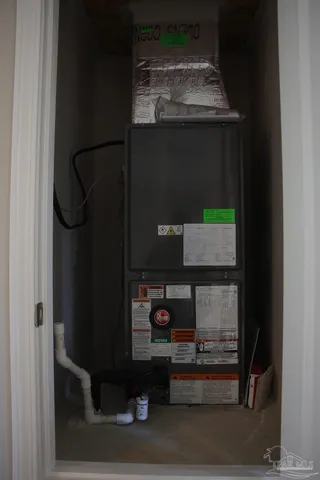 a white toilet and tub sitting next to a bathroom sink