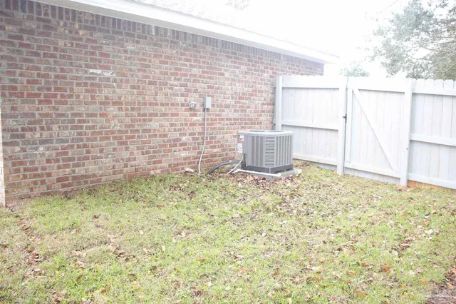 a kitchen with granite countertop a sink and a stove