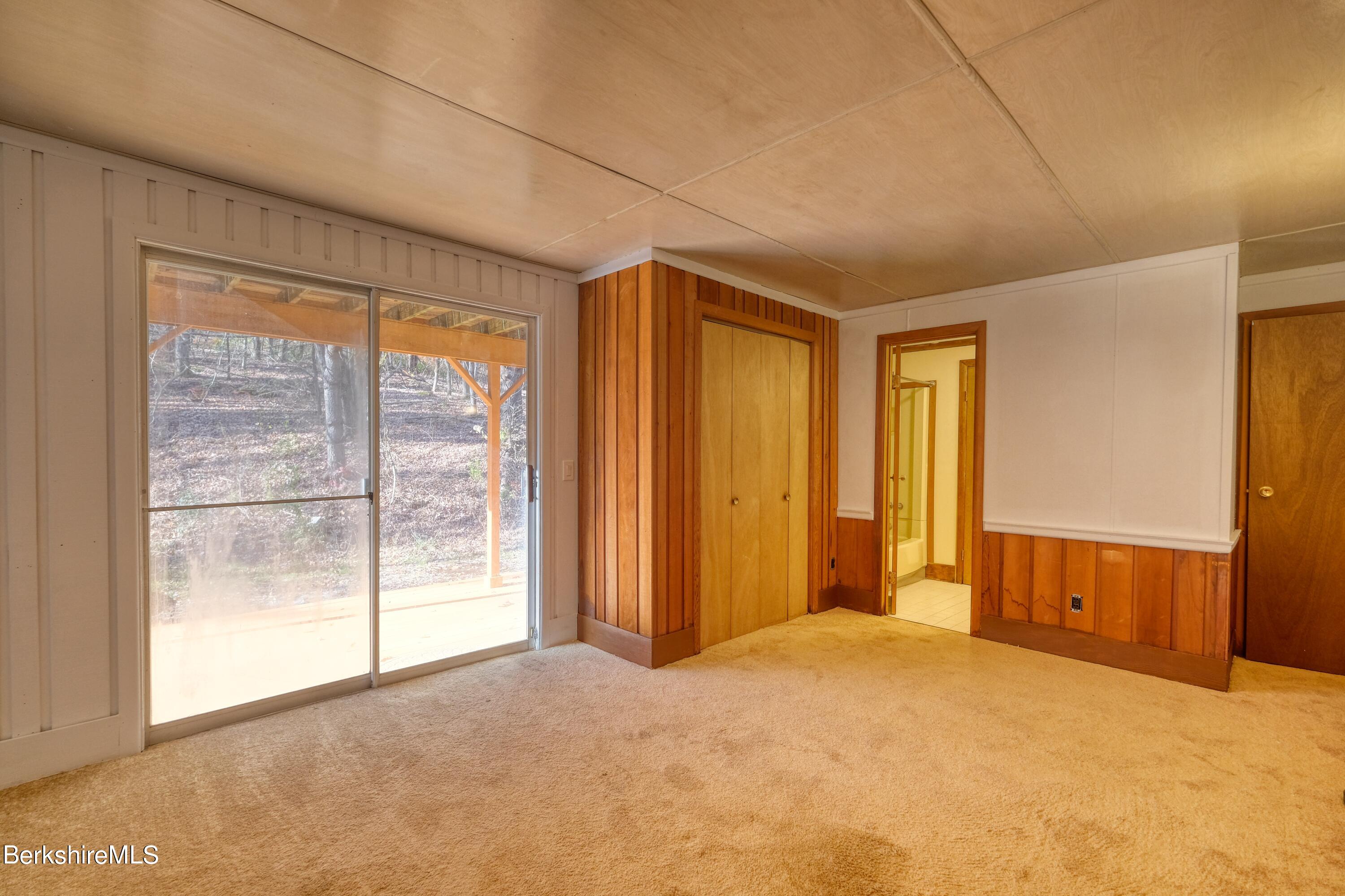 274 East Slope Road Richmond, MA 01201 - Photo 14 of 44 a view of empty room with floor to ceiling window
