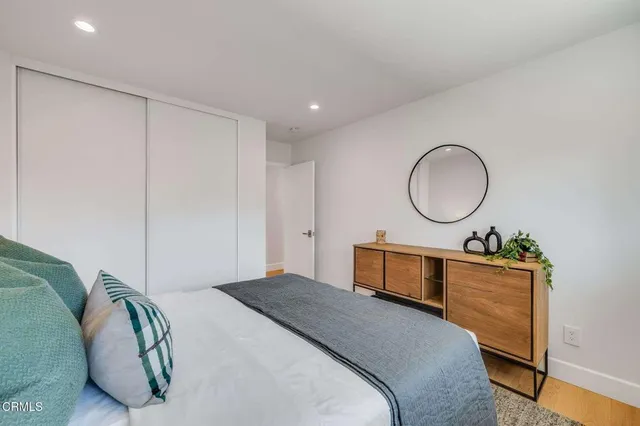 a bathroom with double vanity sinks and a bathtub