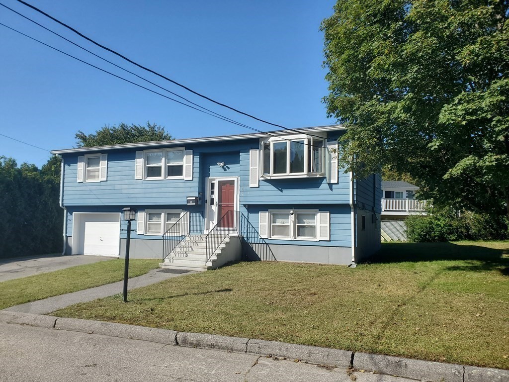 33 Marique Drive Lawrence, MA 01843 - Photo 18 of 20 a front view of a house with a yard