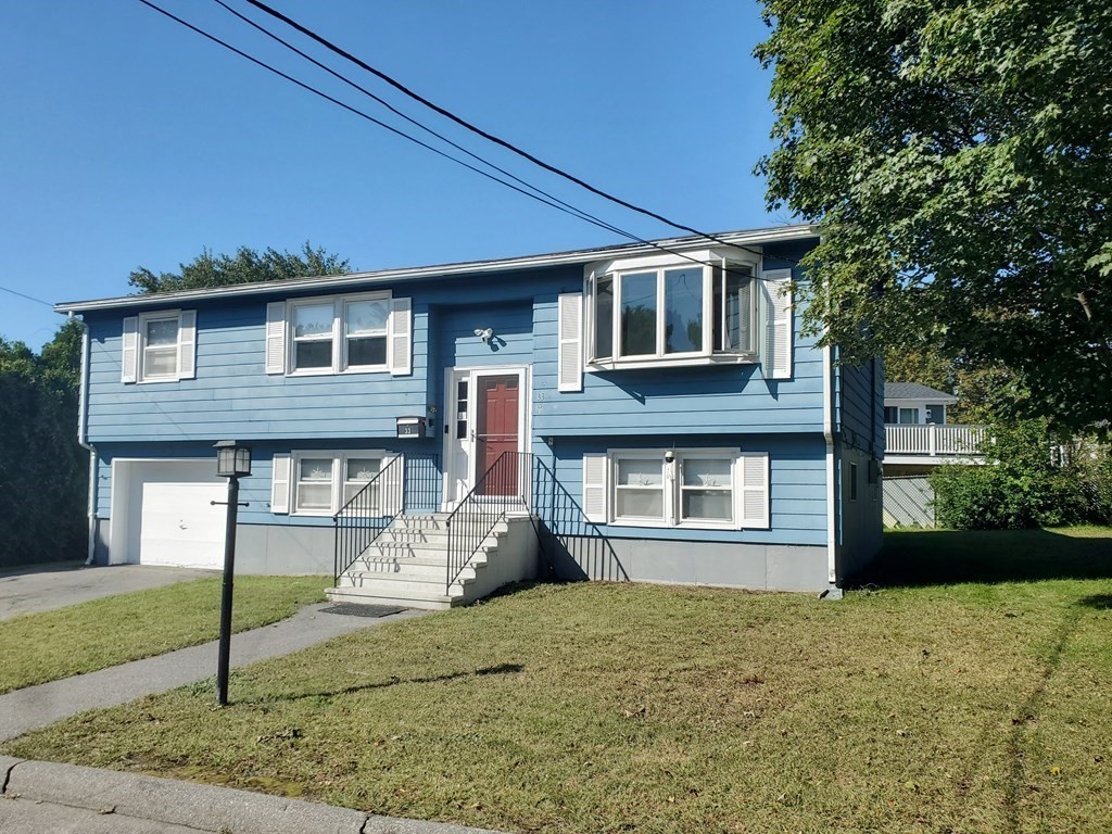 33 Marique Drive Lawrence, MA 01843 - Photo 2 of 20 a front view of a house with garden